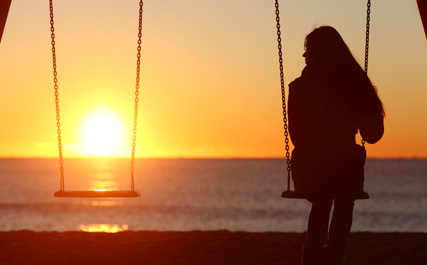 woman-swing-sunset