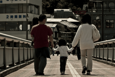 Photo by Jess Lee Cuizon on Flickr; Japan family; GDP vs. parenting model