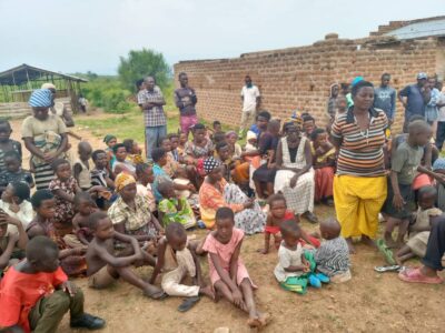 People sitting around in a circle, a neglected community